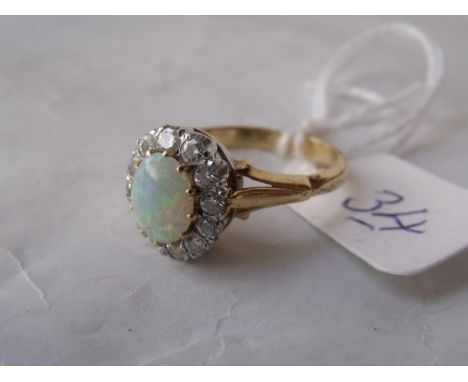 A good opal & diamond cluster ring set  in 18ct gold  'M'  3.6g       