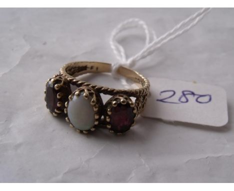 A three stone opal & garnet ring with  fancy 9ct mount 'N'       