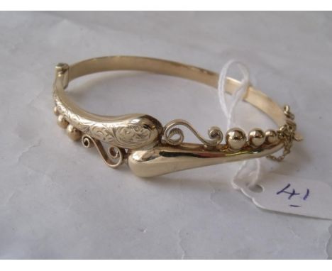 A fancy 9ct hinged bangle 9.5g     