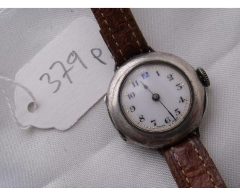 A ladies vintage silver cased  wrist watch with white enamel dial     