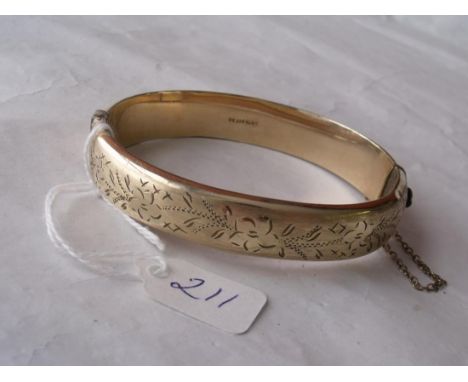 A rolled gold flower embossed hinged  bangle          