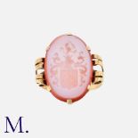 An Intaglio Signet Ring in yellow gold set with an oval carved intaglio carnelian with armorial