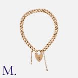 An Antique Rose Gold Curb Bracelet in 9K rose gold bracelet, secured with a heart padlock and safety