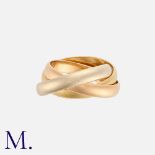 CARTIER. A Trinity Ring with three interlocked bands in 18K yellow, white and rose gold. Signed