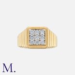 A Gold Ring with stepped shoulders in 9K yellow gold set with nine cubic zirconia stones. Hallmarked