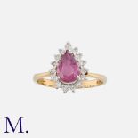 A Pink Sapphire and Diamond Ring in 9K gold, set with a pear-cut pink sapphire and 15 round cut