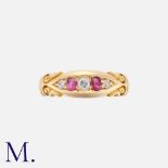 A Ruby And Diamond Five Stone Gypsy Ring in 18k yellow gold, the stylised and set with three round
