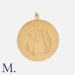 An Antique Engraved Pendant in yellow gold, with monograms either side. Size: 2.5cm Weight: 3.2g