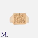 A Gold Signet Ring in 14K yellow gold, with armorial crest to a rectangular face. Marked for 14ct
