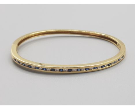 Ladies 18ct yellow gold sapphire &amp; diamond bangle, featuring 17 sapphires and 16 Diamonds, 17.7g