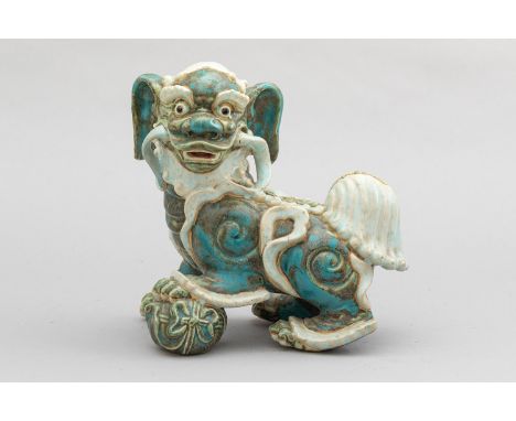 Chinese Fo Lion , holding a ball, ceramic coloured and glazed on the bottom  script signs  signed Qing Dynasty. 24X24 cm