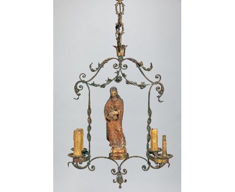 Chandelier with four lights forged iron work with scrolls and volutes painted ,in the centre saint Mary wood sculpture with o