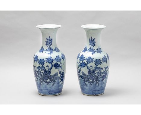 Pair of Chinese Kangxi (1654-1722) porcelain vases, in baluster shape with long neck and outbowed border, painted with blue f