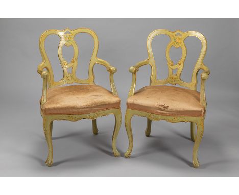 Pair of Venetian arm chairs, each with open work, outsawed and curved back seat and feet, curved armrests; wood carved with c