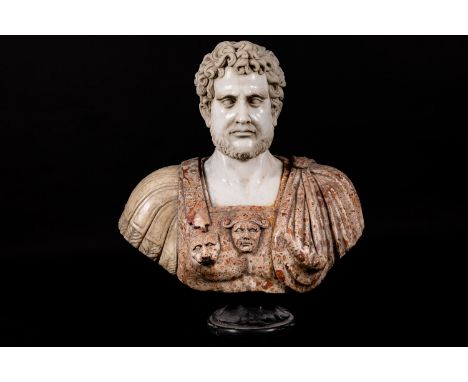 Marble bust of a Roman Emperor with armour and Toga. Sculpted with face and lionhead in red, white , grey and brown marble wi