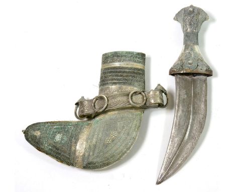 An Arab Jambiya, the curved blade with raised medial ridge, white metal-mounted grip and scabbard