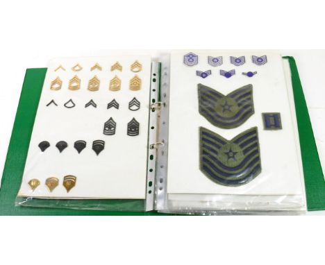 A Collection of Approximately One Hundred US Military Metal Badges, including a post-1949 Sterling silver Pilot wings, white 