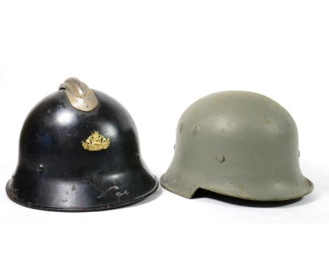 A German Civic Square Dip Helmet, later painted light green, the left side with traces of hand painted Reichswehr shield, eac