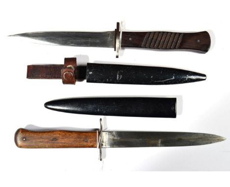 A First World War German Fighting Knife, the 14.5cm single edge steel blade marked at the ricasso with a crowned C, the oppos