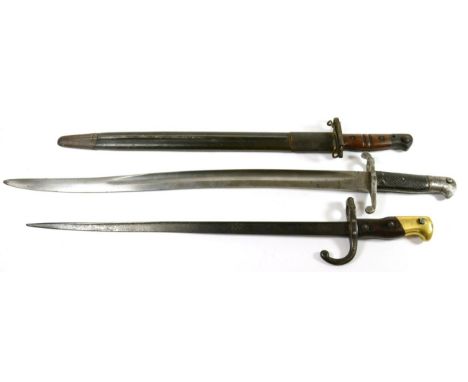 A British 1856 Pattern Sword Bayonet, the fullered steel blade with War Department and inspector's marks, stamped 2/85, crown