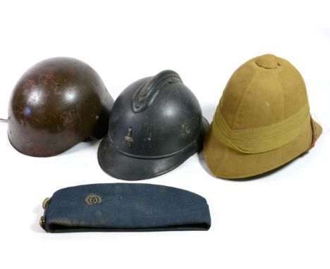 A First World War French M15 Adrian Helmet, with blue paint, the badge lacking the flaming grenade, with leather liner and ch