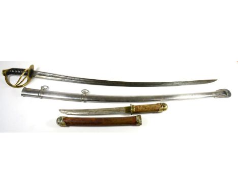 A Cuirassier Type Sword, the 87.5cm single edge curved steel blade with a narrow fuller running along the back edge, the bras