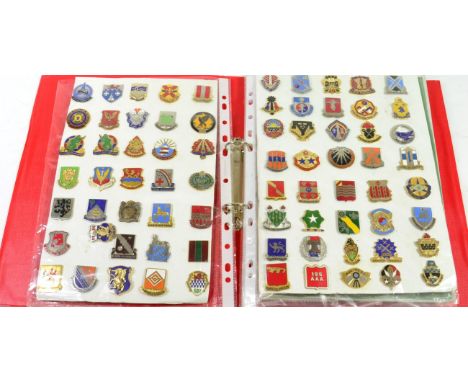 A Collection of Approximately Two Hundred US Army D.I. Pin Badges, in enamelled metal and gilt metal, all loosely mounted on 