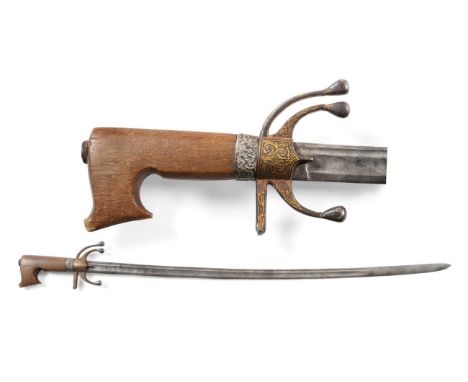 An 18th Century Moroccan Nimcha (Mahratta Sabre), each side of the 87cm single edge steel blade with a broad fuller and a nar