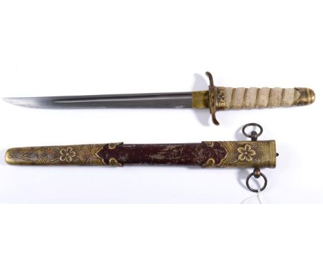 A Japanese Naval Dirk, the 22.5cm single edge steel blade with a narrow fuller, the brass habaki with an engraved lozenge mar