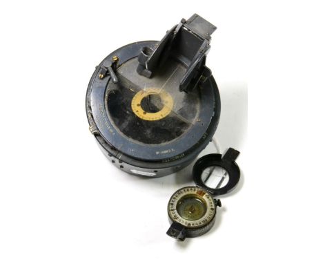 A Second World War Pocket Compass by T G Co.Ltd., London, the back stamped MK.III, with broad arrow, maker's name, dated 1942