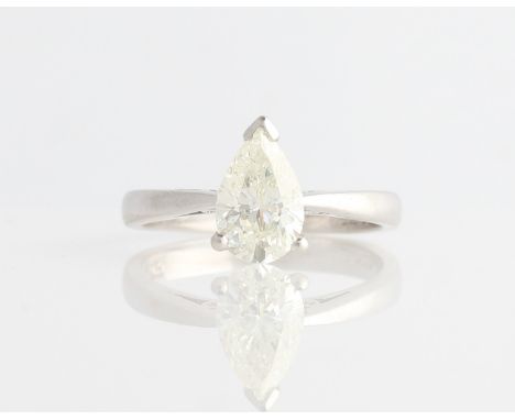 A platinum diamond solitaire ring, set with a pear cut diamond, measuring approx. 1.28ct, hallmarked London 2003, ring size K