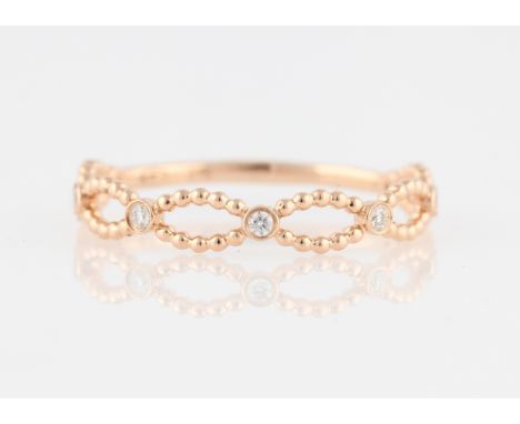 *A diamond set ring, set with round brilliant cut diamond accents in open metalwork design, stamped 375, ring size N.