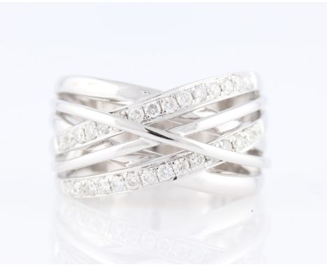 *A diamond set cross over design ring, two bands of the cross over design set with round brilliant cut diamonds, white metal 