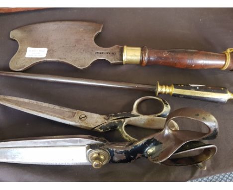 An F. Eardley mahogany and brass handled meat cleaver with a set of Wilkinson tailor scissors, a similar set of scissors and 