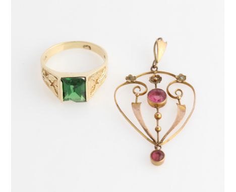 An early 20th Century red paste open metalwork pendant, stamped 9ct, together with a gents green paste ring, size M½, stamped