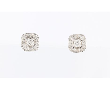 *A pair of diamond cluster design earrings, each set with a central round brilliant cut diamond, measuring approx. 0.07ct, su