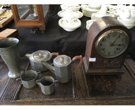 A mantel clock with art nouveau style carved design with pewter arts and craft ‘Tudoric’ 01650 four piece tea/coffe set inclu