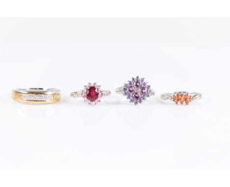 A lot to include, a treated ruby and pink sapphire cluster ring, an orange sapphire ring, a seven stone diamond ring, and a m