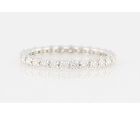 *A diamond full eternity ring, set with 28 round brilliant cut diamonds, total diamond weight approx. 0.85ct, white metal sta
