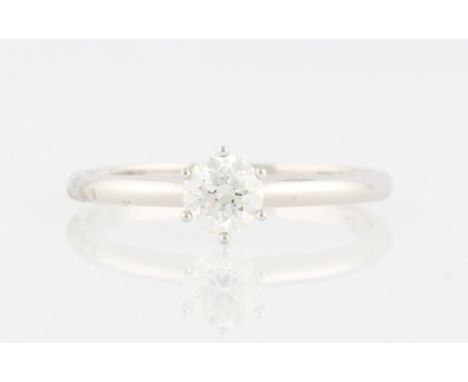 A diamond solitaire ring, set with a round brilliant cut diamond, measuring approx. 1ct, stamped 18K, ring size Z+3, with acc