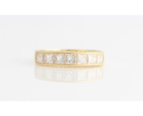 An 18ct yellow gold diamond half eternity ring, set with seven princess cut diamonds, total diamond weight approx. 1.20ct, ha