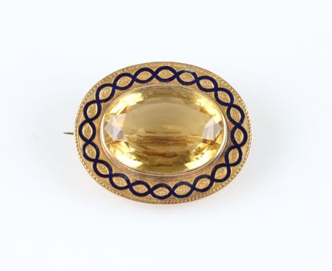 A citrine and enamel brooch, set with an oval cut citrine, measuring approx. 26x19mm, surrounded by a border of weave design 