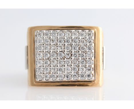 A gents hallmarked 9ct yellow gold cubic zirconia watch design ring, the rectangular head set with round cut cubic zirconias,