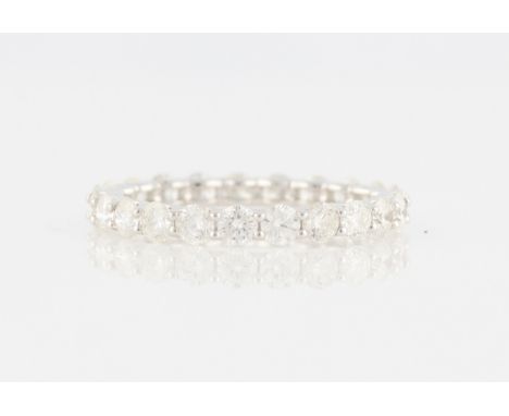 *A diamond full eternity ring, set with 23 round brilliant cut diamonds, total diamond weight approx. 2.30ct, white metal sta
