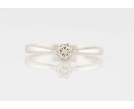 An 18ct white gold diamond solitaire ring, set with a round brilliant cut diamond, measuring approx. 0.35ct, hallmarked Londo