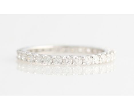 *A diamond full eternity ring, set with 30 round brilliant cut diamonds, total diamond weight approx. 0.90ct, white metal sta