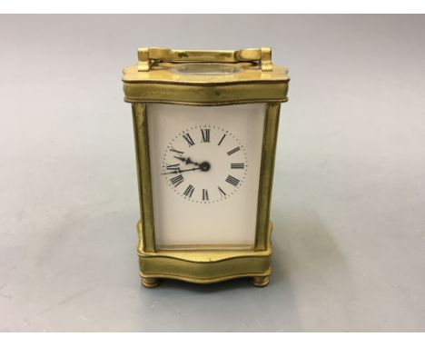 A small carriage clock, height 14cm.