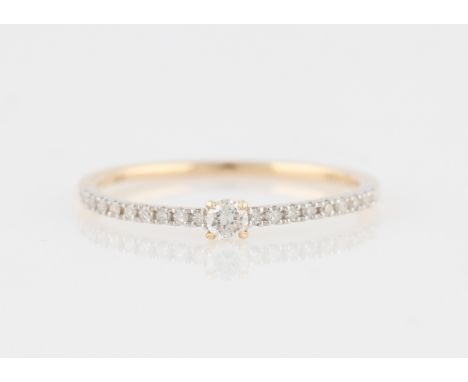 *A diamond ring, set with a principal round brilliant cut diamond, measuring approx. 0.07ct, with further diamond accents to 
