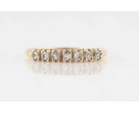 A seven stone diamond half eternity ring, set with seven round cut diamonds, stamped 14k, ring size K½.