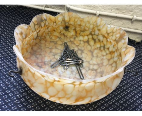 An early twentieth century orange glass lamp shades.